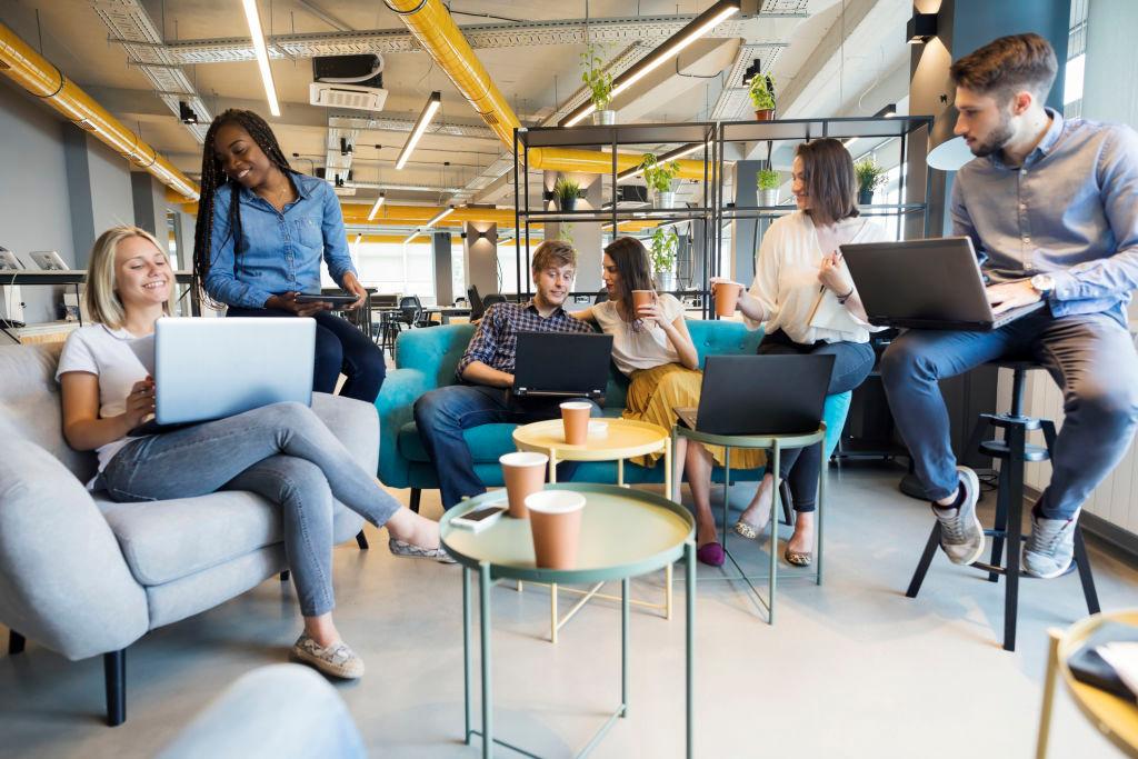 Young people making strategy for startup business in modern co working space