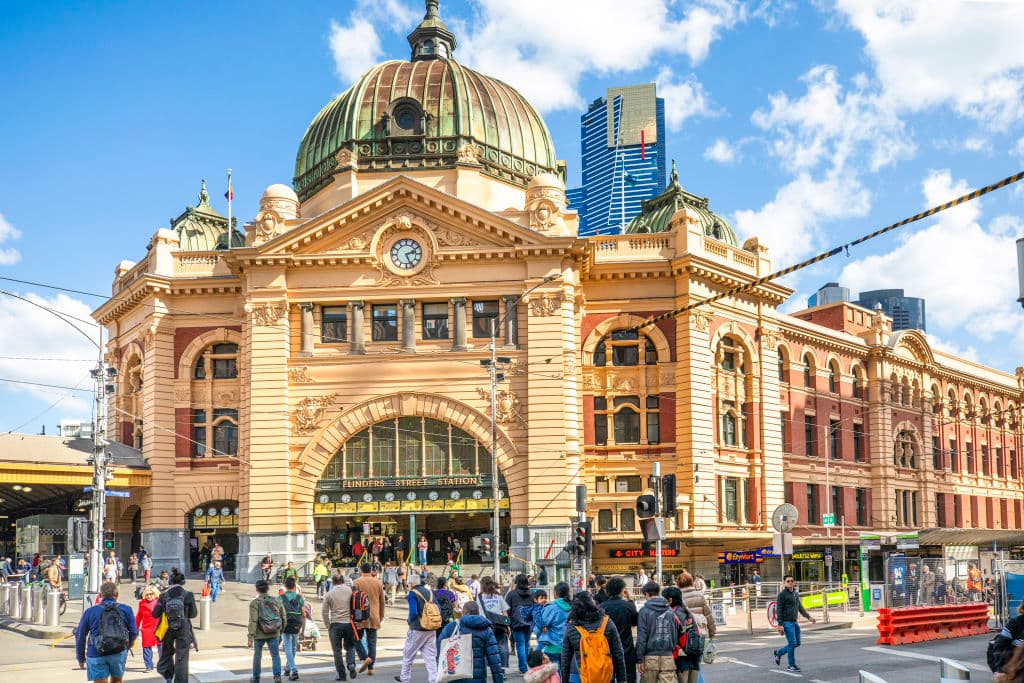Flinders Street Station in bright sunlight.