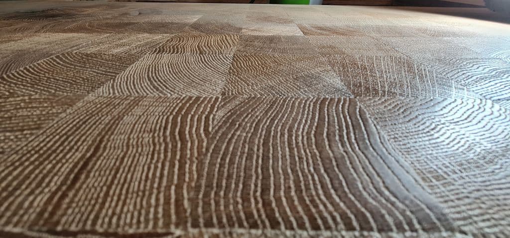 Endgrain_parquetry_from_300_year_old_oak_trees_applied_in_a_Hong_Kong_Gallery._Photo_Renaissance_Parquet_abppsm