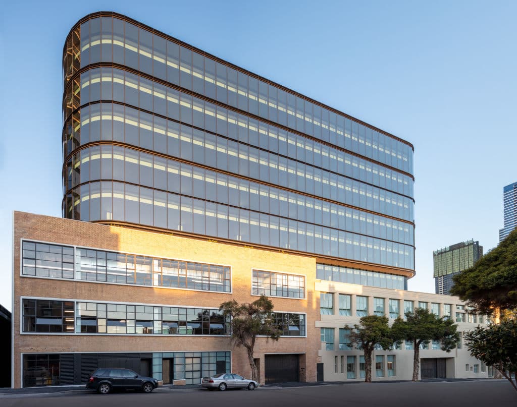 The_rear_annexes_now_foreground_a_major_Melbourne_biomedical_building._Photo_Gray_Puksand_otzfi3