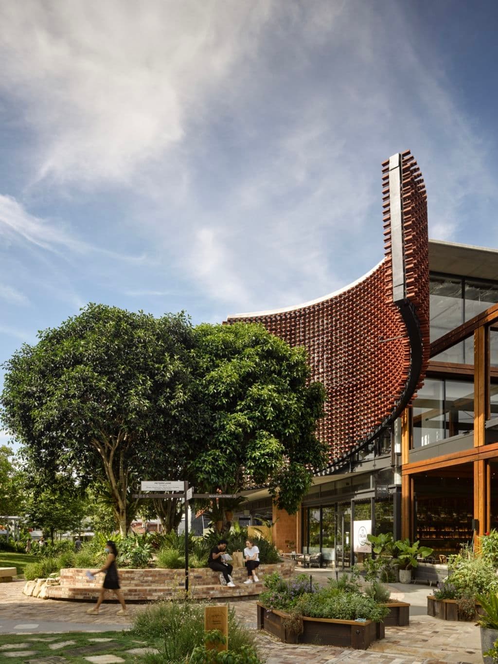 KThe-Eaves_building_was_designed_to_hug_an_existing_fig_on_the_site_at_West_Village._Photo_Christopher_Frederick_Jones_l5mwo5