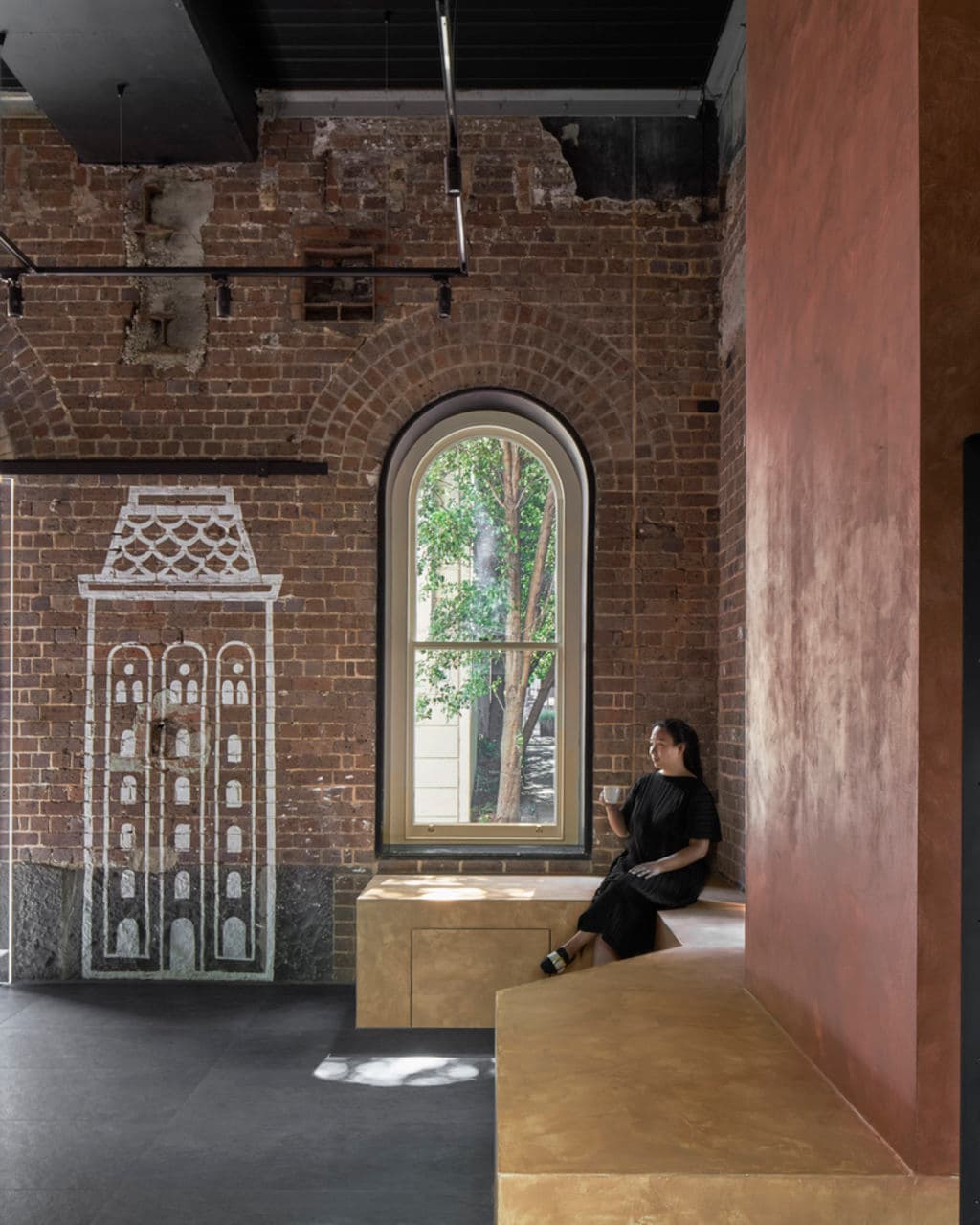 The_corner_bench_is_the_whole_seating_offering_and_the_graphic_was_an_inheritance_in_the_space._Photo_Peter_Clarke_e37kz1