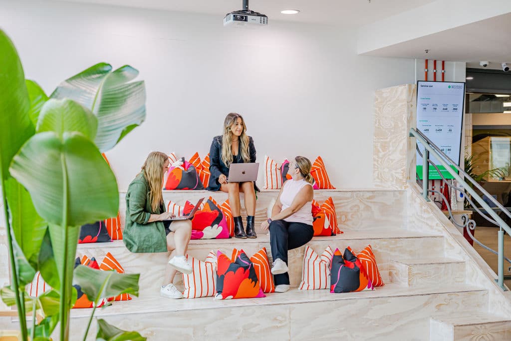 Young women with laptops in coworking space