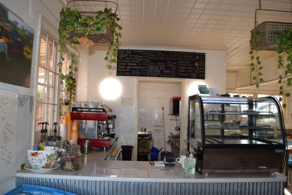 Cafe with coffee machine and chalkboard