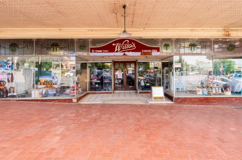 Facing straight on the shopfront's roof has pressed tin features, and a lampshade welcoming guests.
