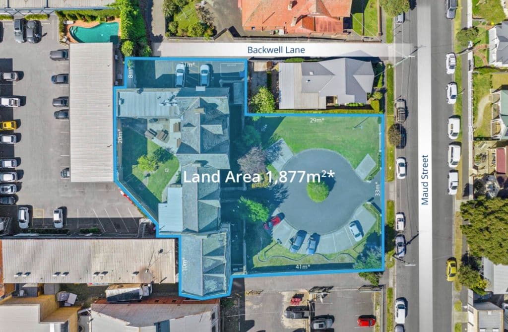 An aerial view of the building and its sprawling grounds.