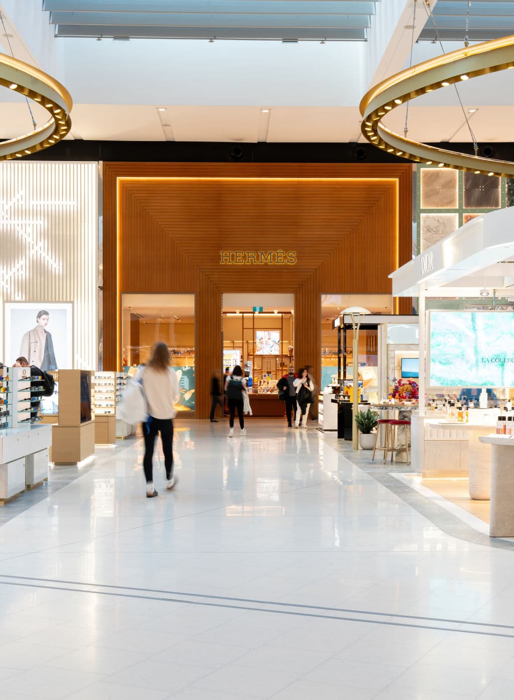 Airport retail outlet with Hermes store in the background