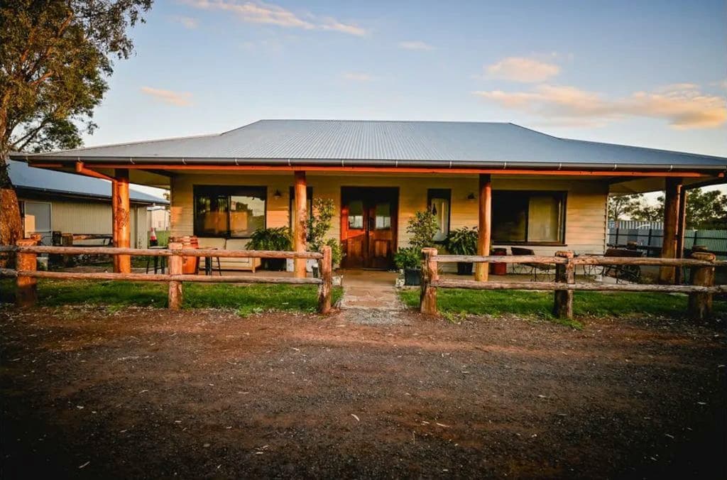 The two-bedroom residence boasts timber posts and fencing.