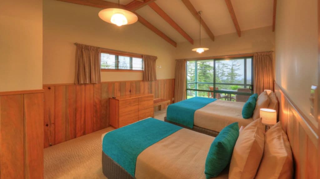 The interior of a bedroom showing two beds at Endeavour Lodge.