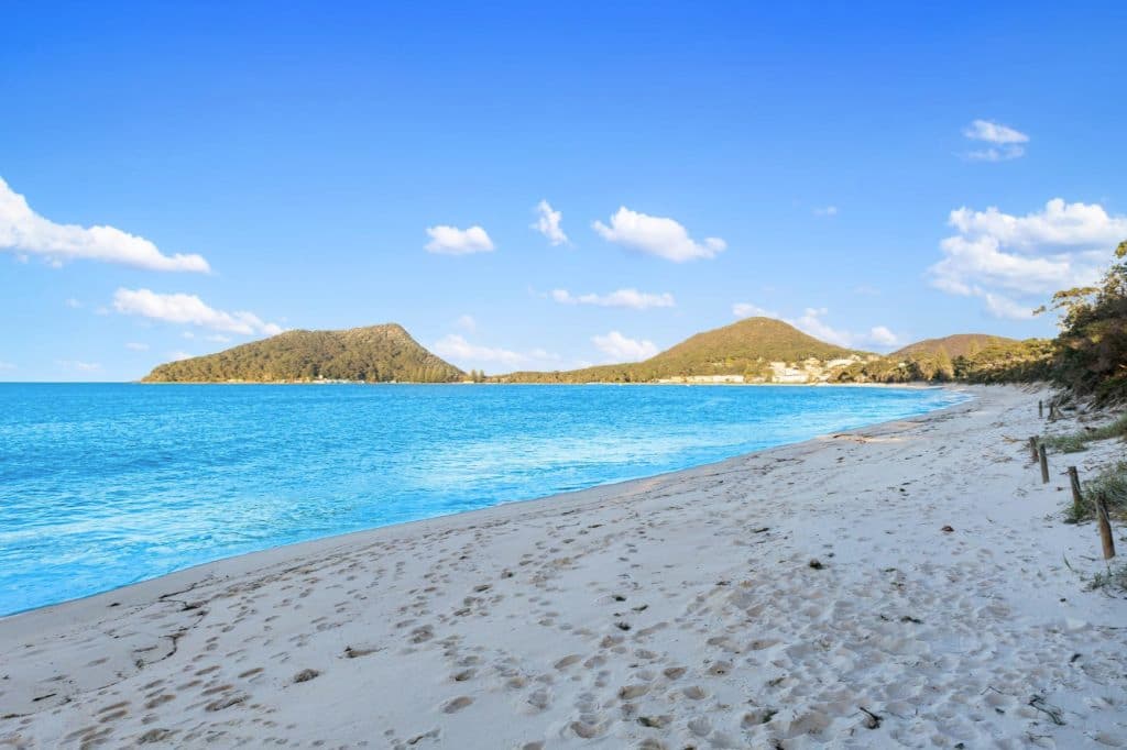 Mountain views with water and sand.