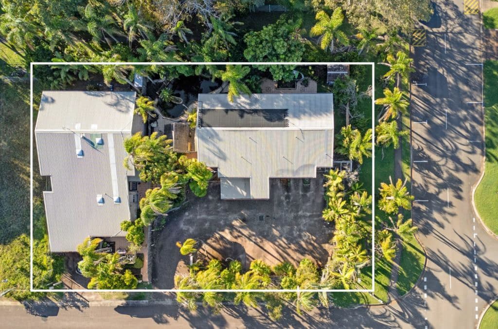 An aerial image of the block as it stands today surrounded in greenery.