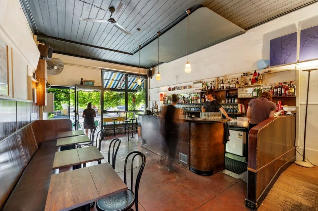 The downstairs front bar is curved with wood panel Art Deco features.