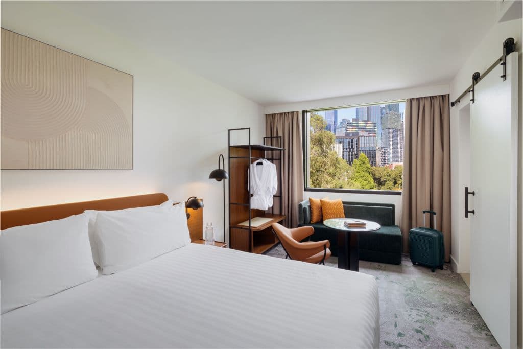 Hotel room with king size bed and small living space