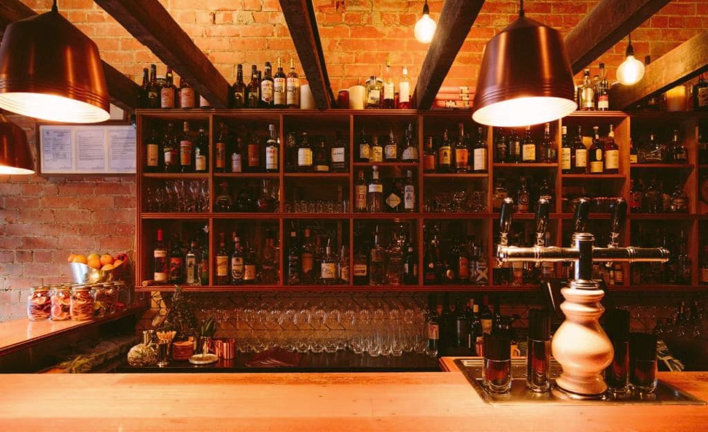 The bar is stocked with plenty of wine and spirits.