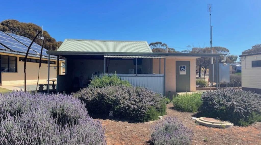 Lavender bushes surround the wheelchair-accessible amenities.