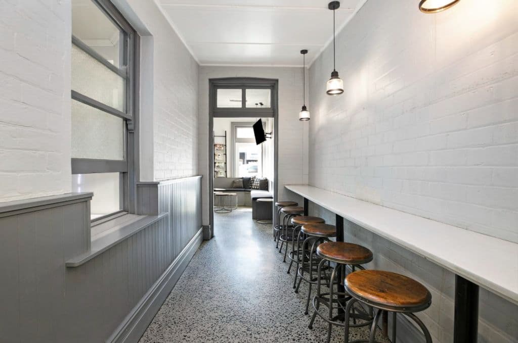 A hallway to sit and have a bite to eat with seating.