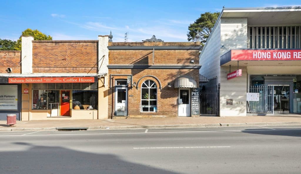 A brick building on the street with heritage appeal.