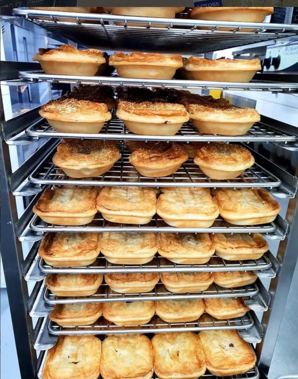 Pies out of the pie warmer all stacked up.