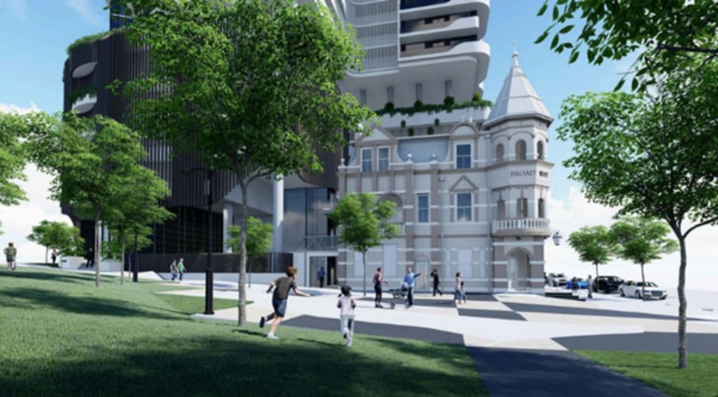 A render of the approved development shows the pub restored with a tower behind.