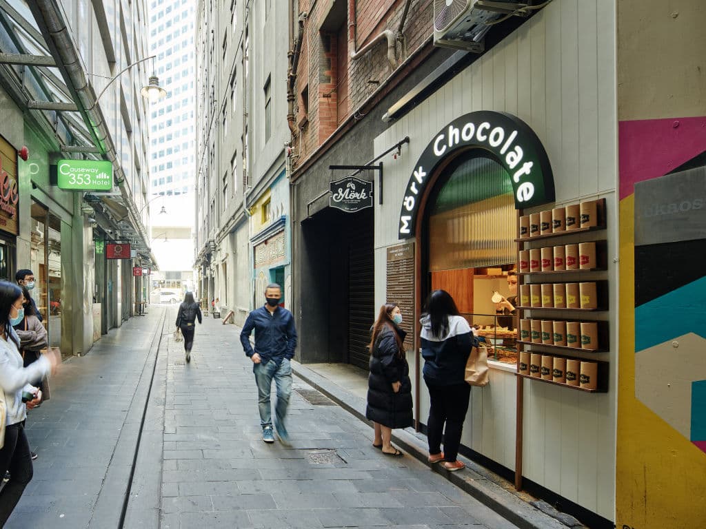 The hole in the wall opens onto Equitable Place, a pedestrian laneway.