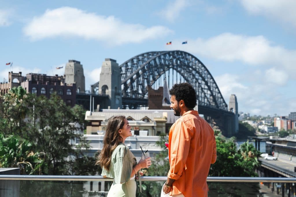 Couple enjoying a drink with iconic Sydney views from the rooftop restaurant at the Museum of Contemporary Art, Canvas Restaurant. @mca_australia @canvas_mca