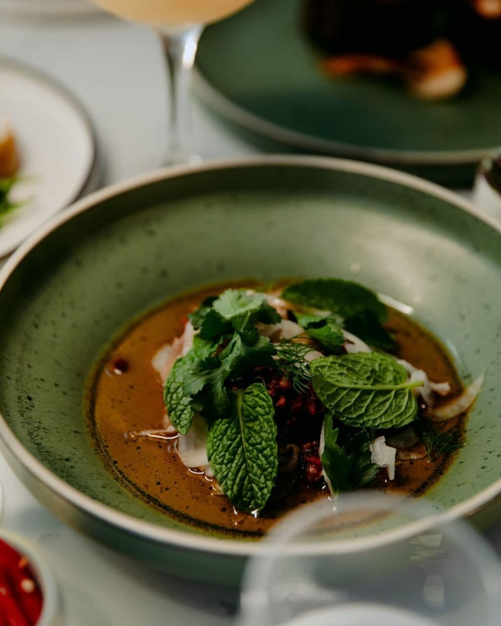 A dish in Amora Hotel Brisbane's restaurant, Dapl, flourished with herbs picked from its inhouse urban farm.