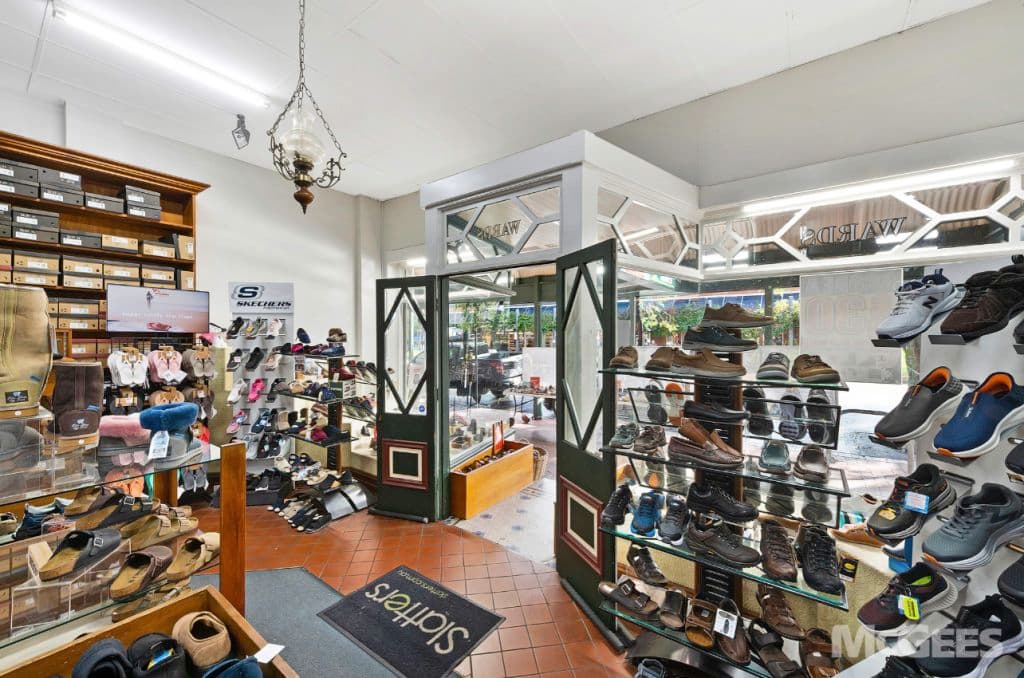 The open front doors of the shoe shop.