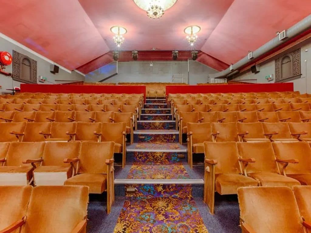 Old chairs line the theatre.