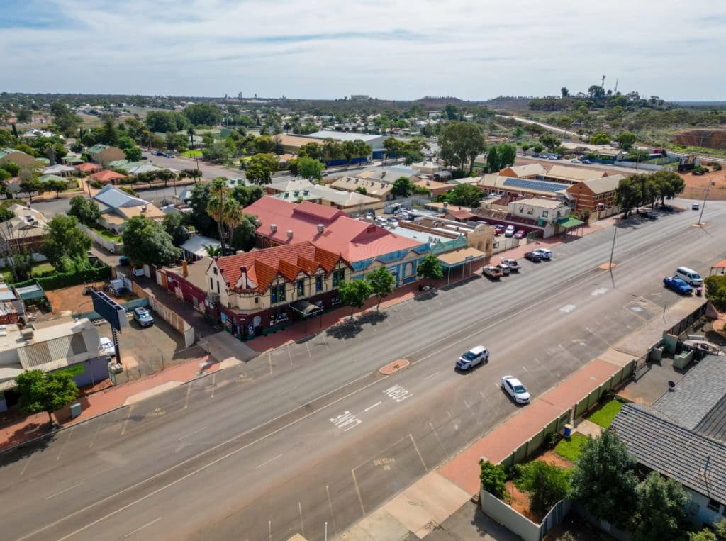 An aerial view of the site along a main road.