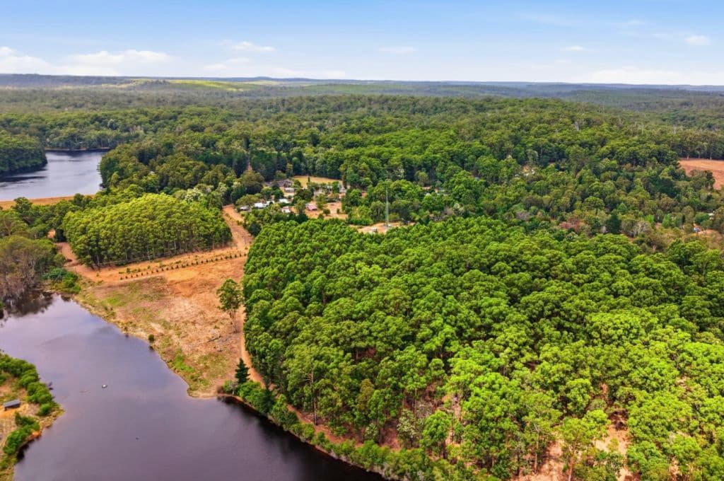 Aerial images shows the park near a lake.