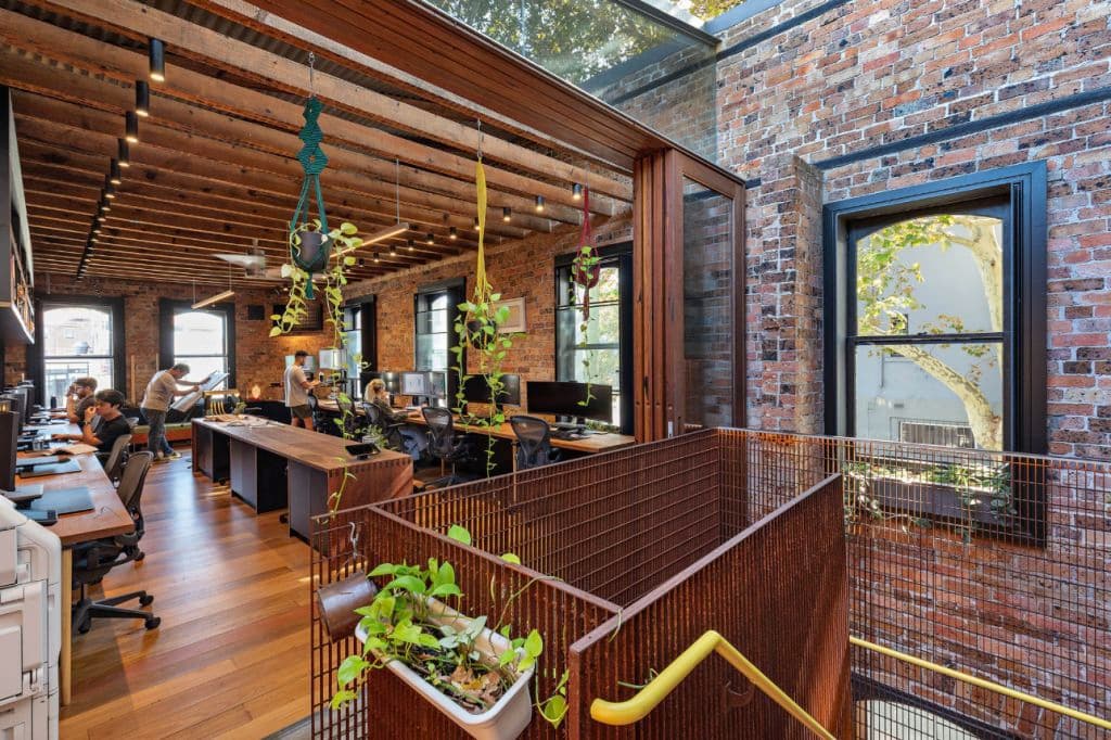 Natural light and cross-ventilation breathe fresh air into the workspace that fits about 12 on the first floor.