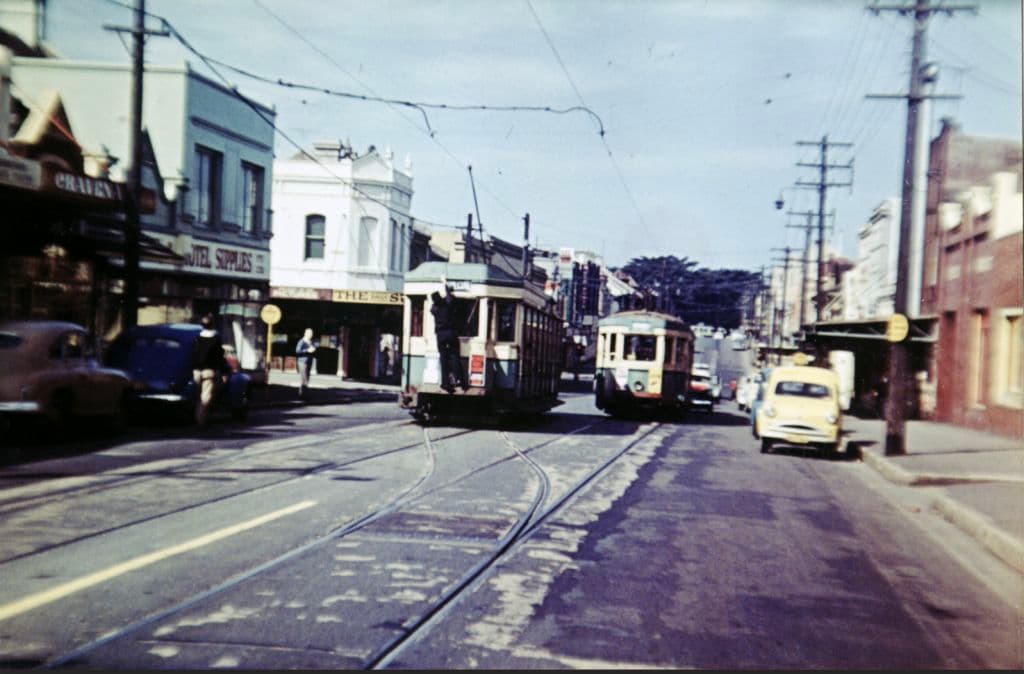 Trams along a street in Surry Hills.
