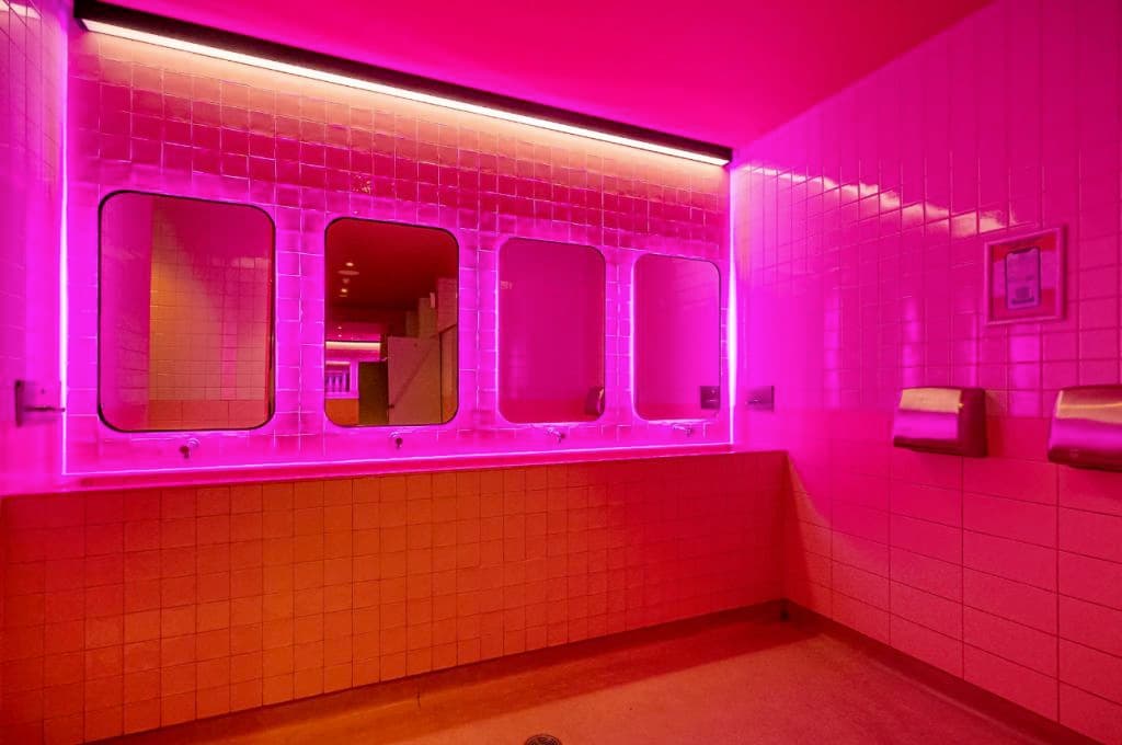 The nightclub bathrooms offer a bright pink aesthetic.