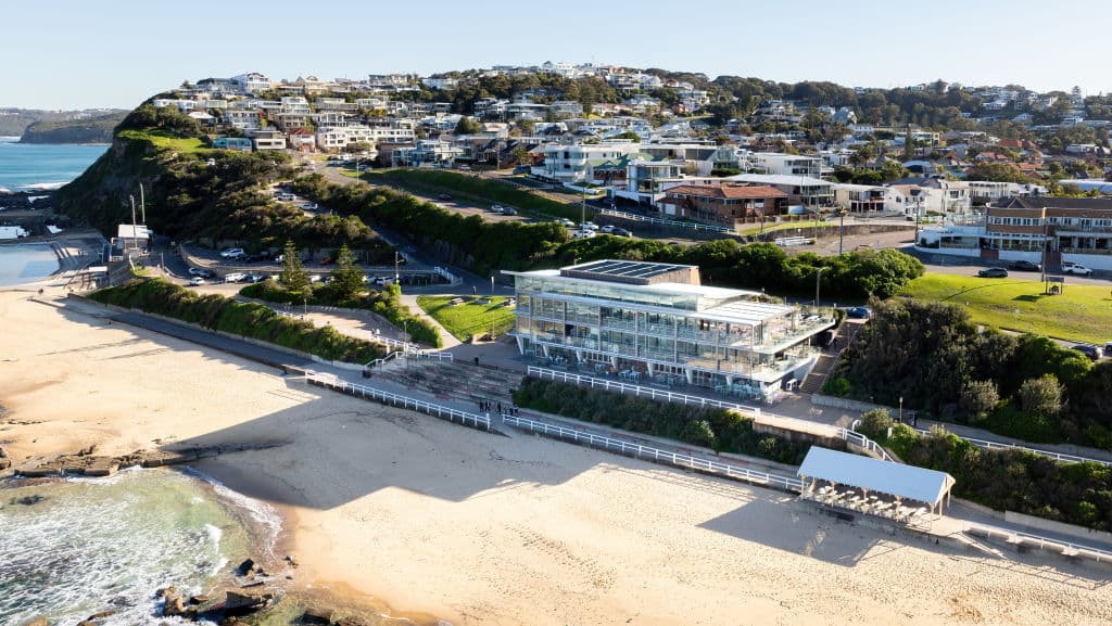 An aerial view of the property and its beachfront position
