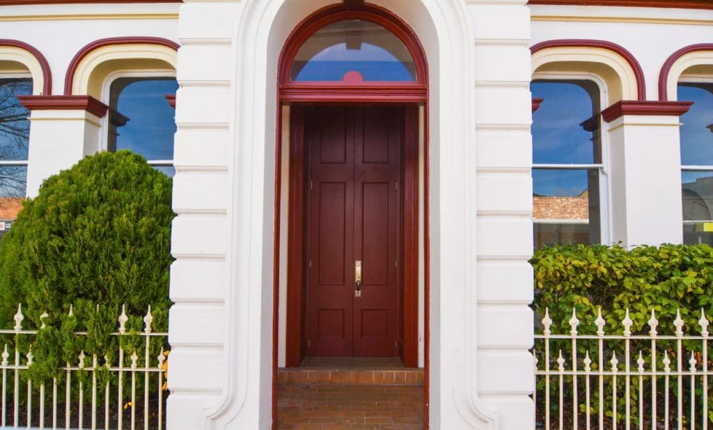 A grand entrance with a timber door.