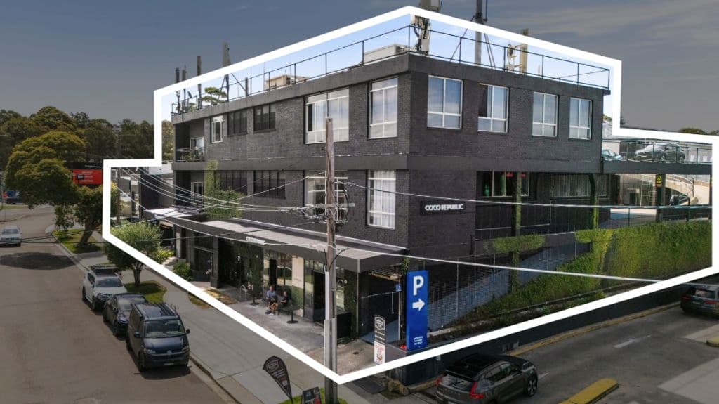 An exterior view of a grey building.