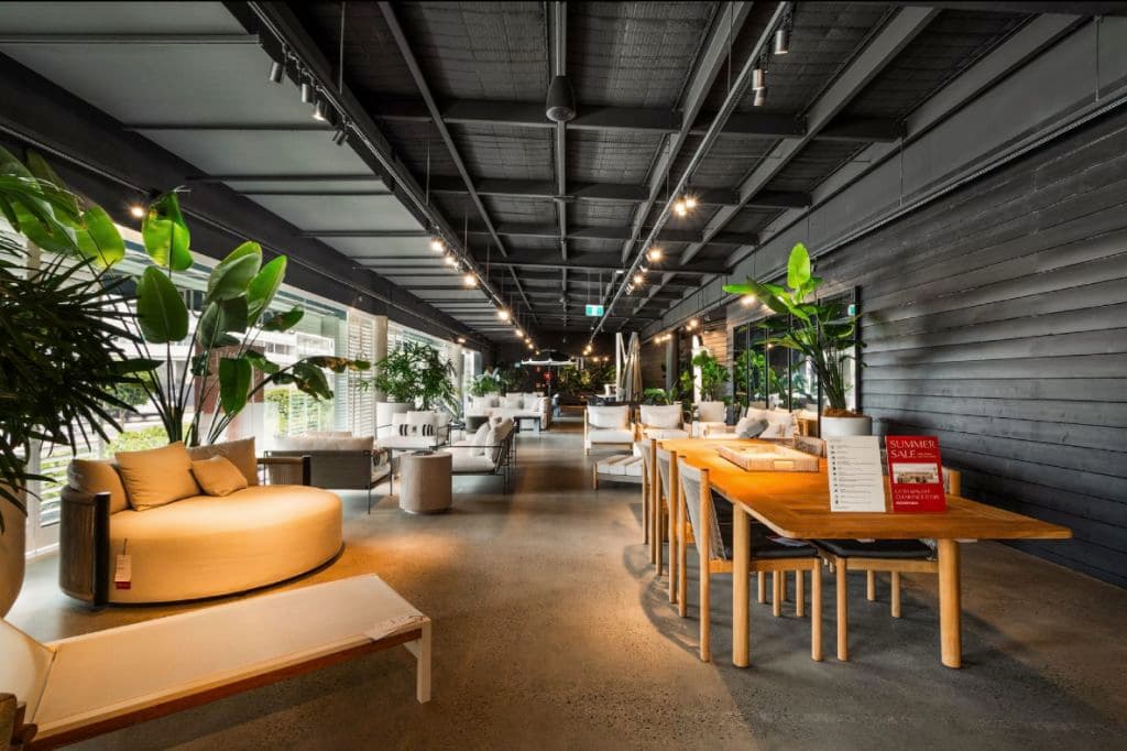 Furniture scattered throughout a showroom space.