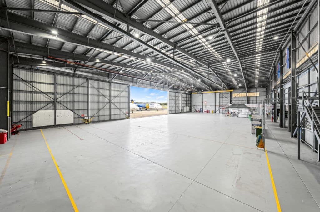 A vacant space inside a hangar.