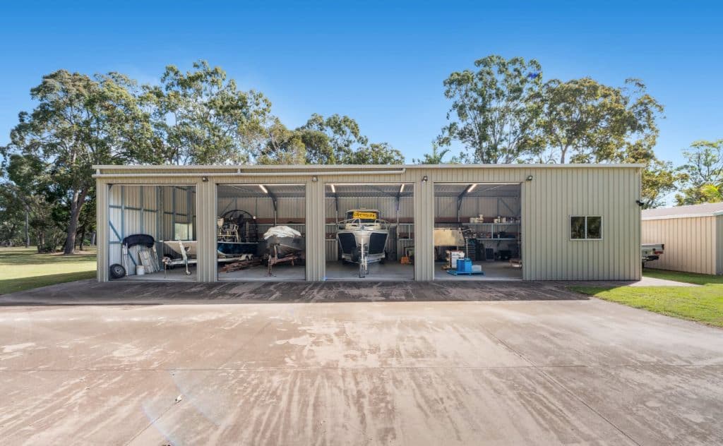 A shed with four roller-doors.