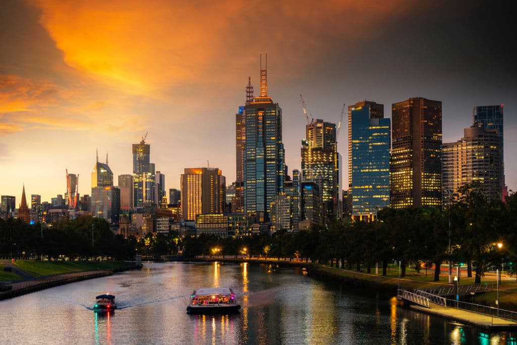 A perspective overlooking Melbourne's city at night with lights on