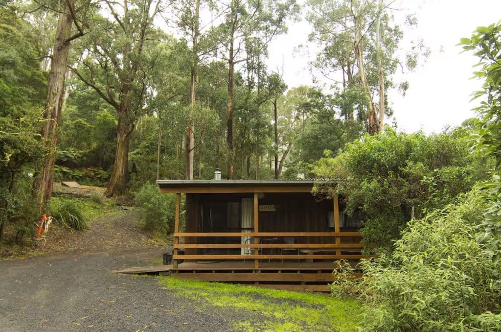 A cabin on lush grounds.