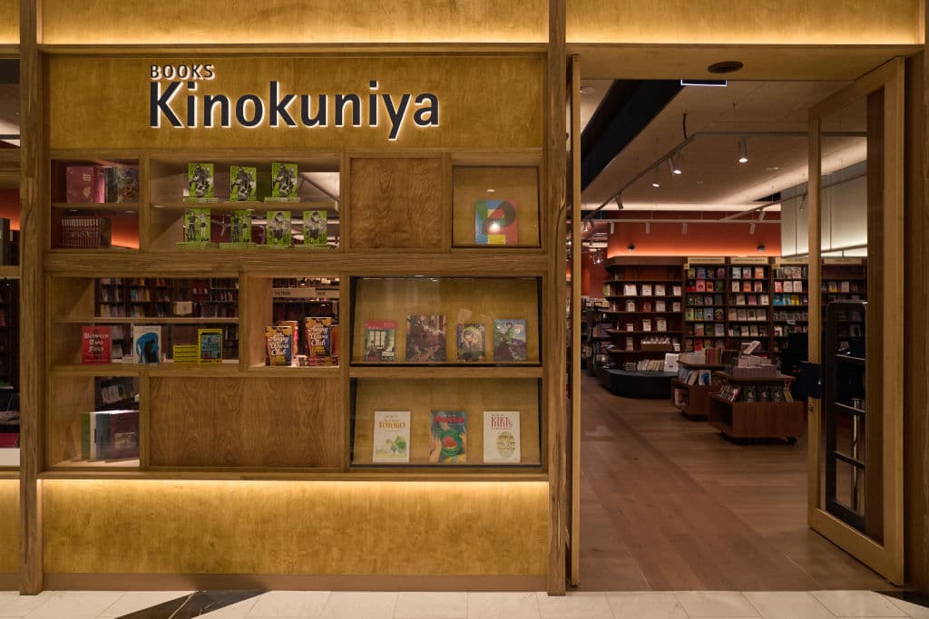 The wooden look surface of the front of the bookstore.