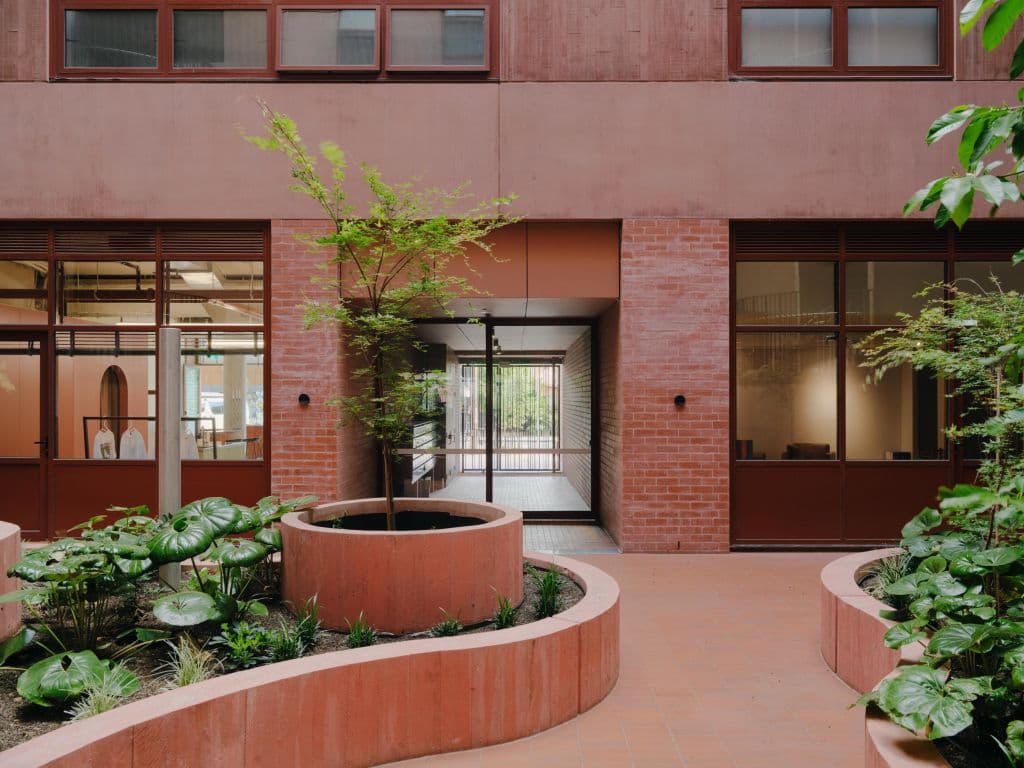 The red-toned bricks of the 9 Wilson Street entrance marry the shade of Jewell Station.