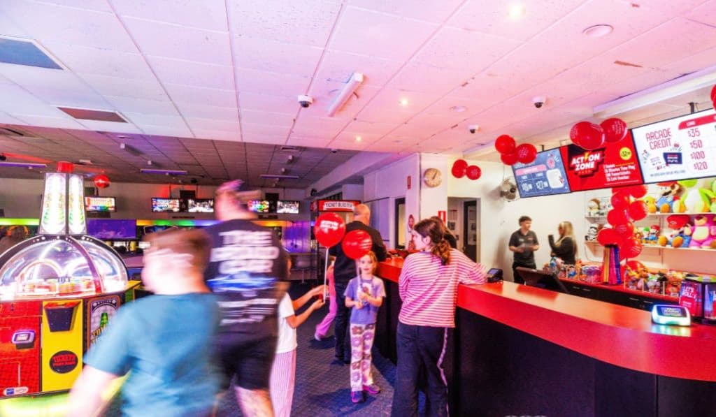Children at the shoe counter inside the bowling alley.
