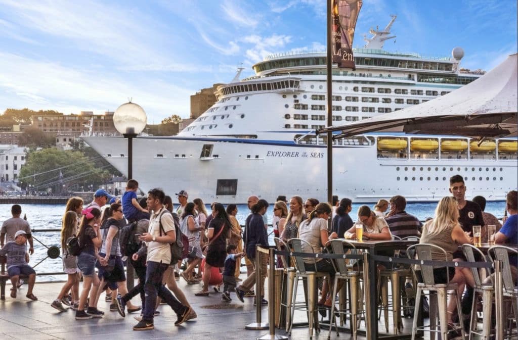 A large cruise ship is seen from the restaurant.