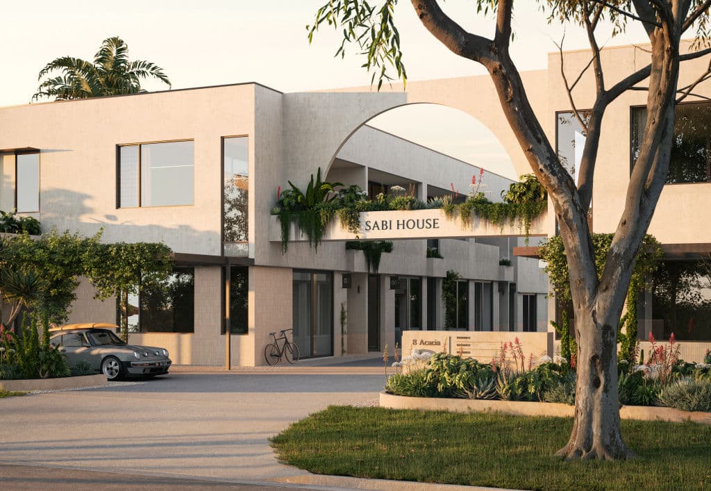 The building offers plenty of greenery and a sculpted form with natural materials.