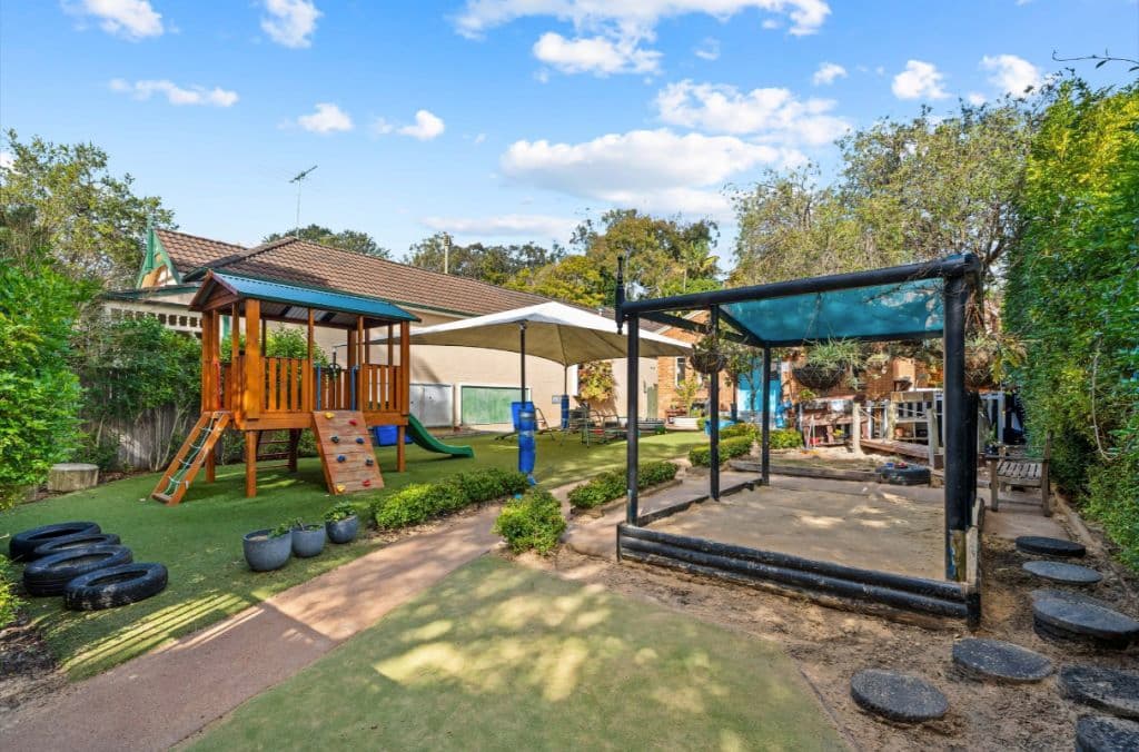 The spacious rear yard features a range of play equipment suitable for children aged between two and six.