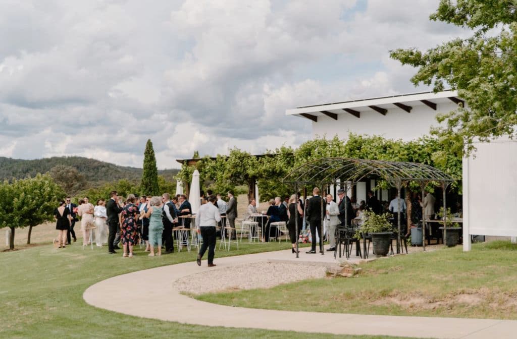 Wedding guests at the lawn outside the restaurant and cellar door space.